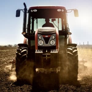 Tractor agricultural machine working in the field.